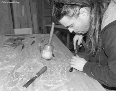 Michael Mayr carving a door