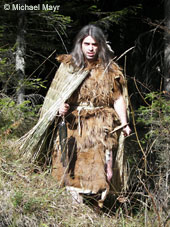 Michael wearing the re-created clothing and equipment of Otzi, the 5300 year-old frozen hunter